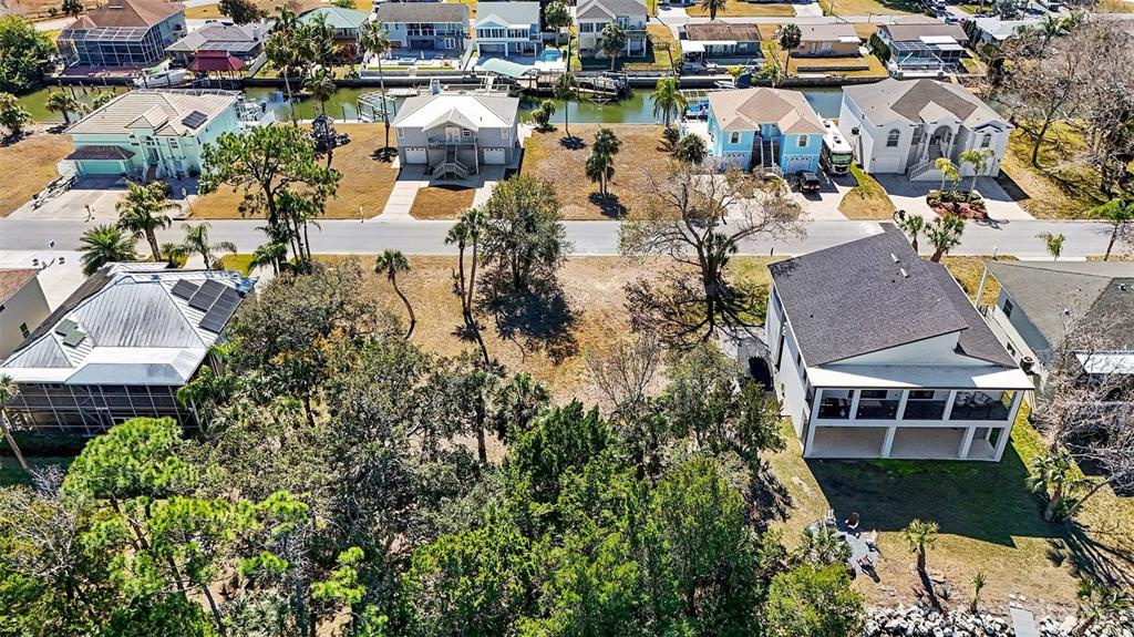 an aerial view of a house with a lake view