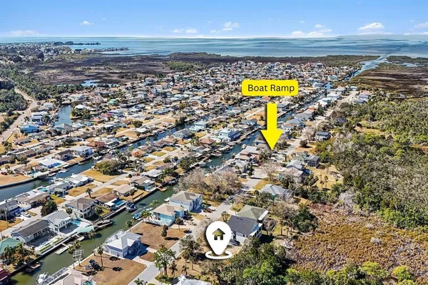 an aerial view of beach and city space