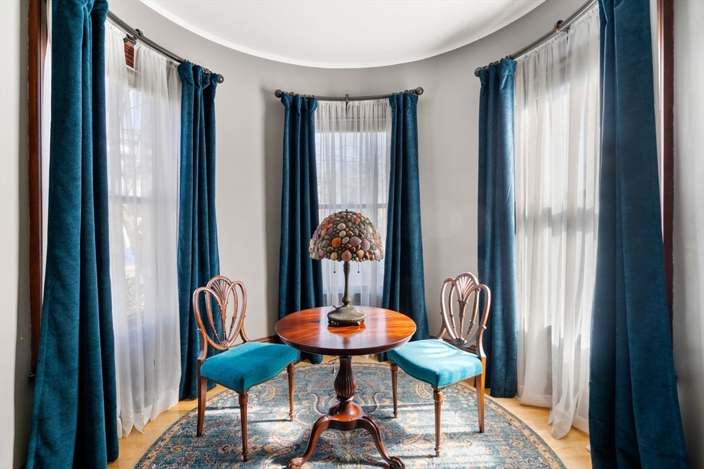 357 Crescent Street Waltham, MA 02453 - Photo 13 of 41 a room with furniture and a window