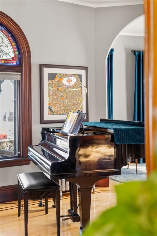 357 Crescent Street Waltham, MA 02453 - Photo 14 of 41 a living room with furniture and a piano