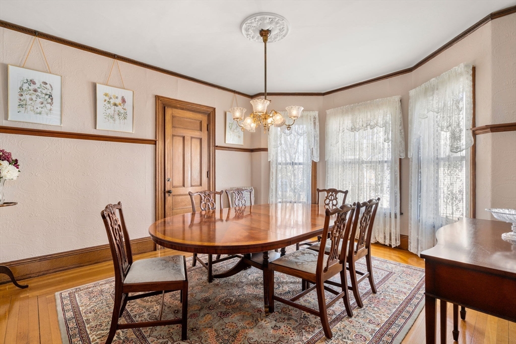 357 Crescent Street Waltham, MA 02453 - Photo 15 of 41 a dining room with furniture and window