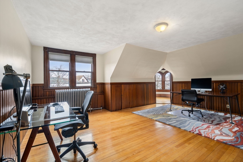 357 Crescent Street Waltham, MA 02453 - Photo 33 of 41 a workspace with furniture hardwood and a window