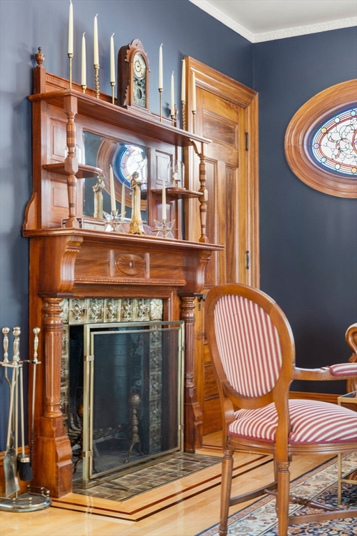 357 Crescent Street Waltham, MA 02453 - Photo 8 of 41 a front view of a fireplace with wooden floor