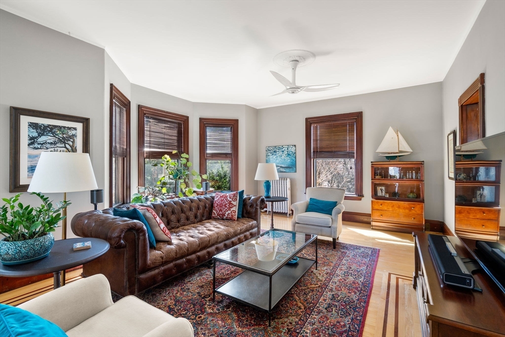 357 Crescent Street Waltham, MA 02453 - Photo 10 of 41 a living room with furniture and a flat screen tv