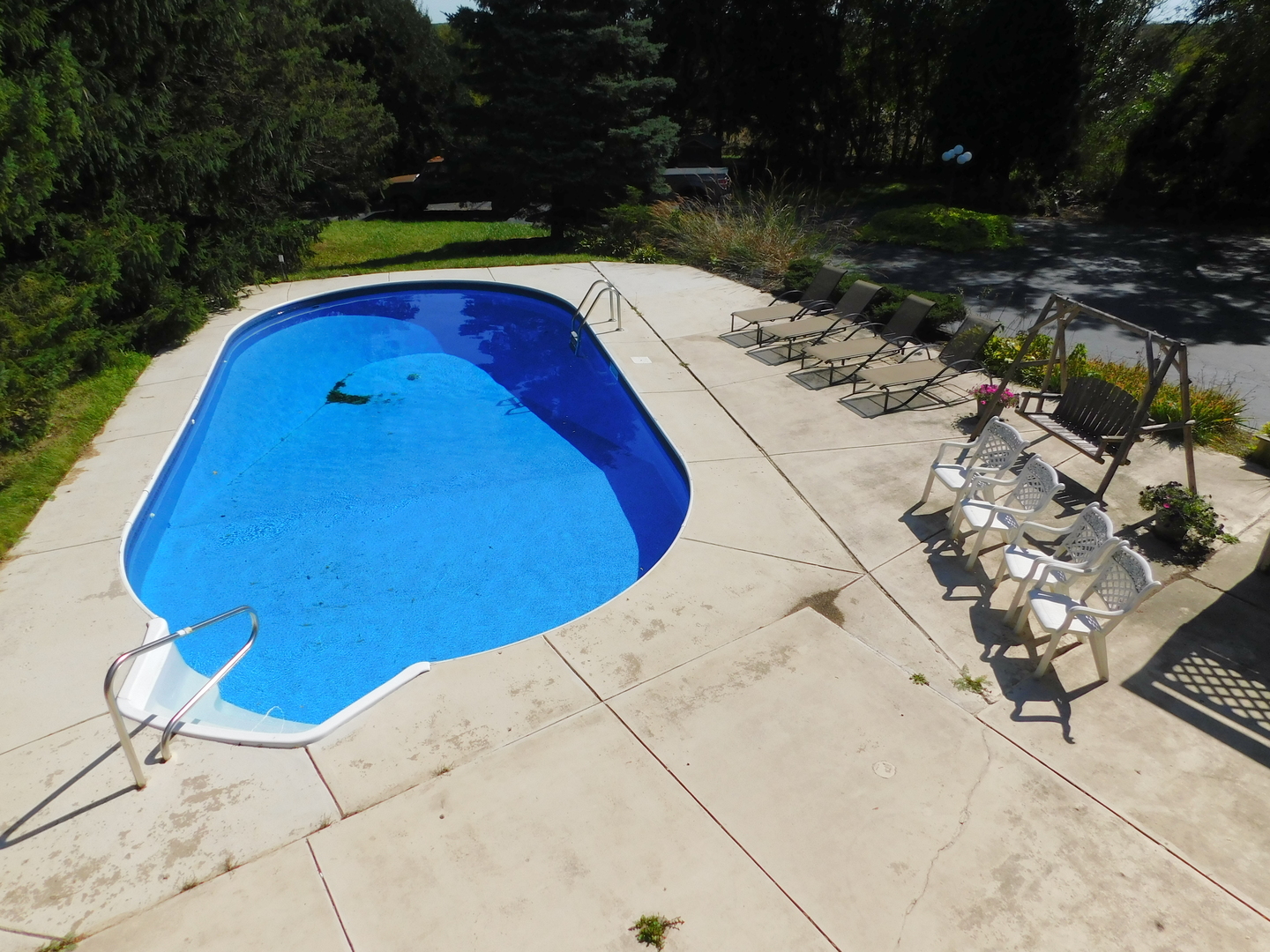 7737 Barnard Mill Road Richmond, IL 60071 - Photo 3 of 40 a view of swimming pool with a patio