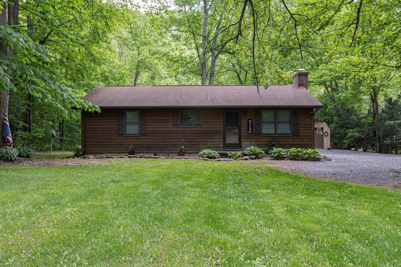9385 Briery Branch Road Dayton, VA 22821 - Photo 1 of 75 a front view of a house with a garden