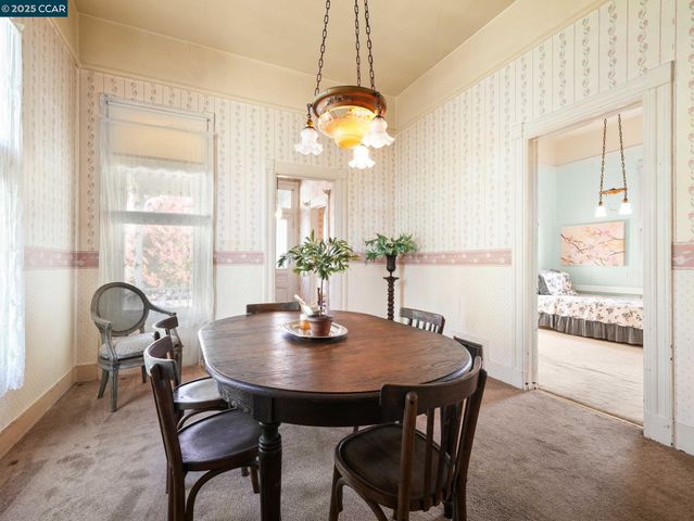a dining room with furniture and window