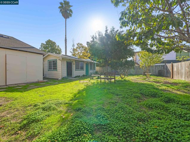 a swimming pool with outdoor seating and yard