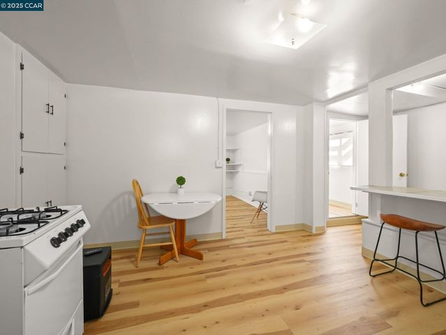 a spacious bedroom with a bed and a chair