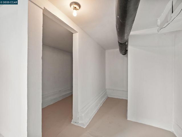 a view of a livingroom with furniture and a ceiling fan