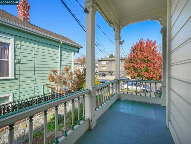 a view of a porch with a table and chairs