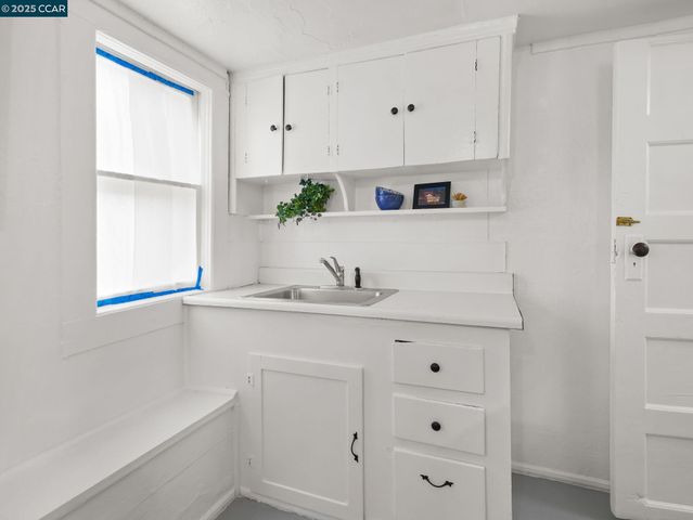 a aerial view of a house with a big yard and large trees