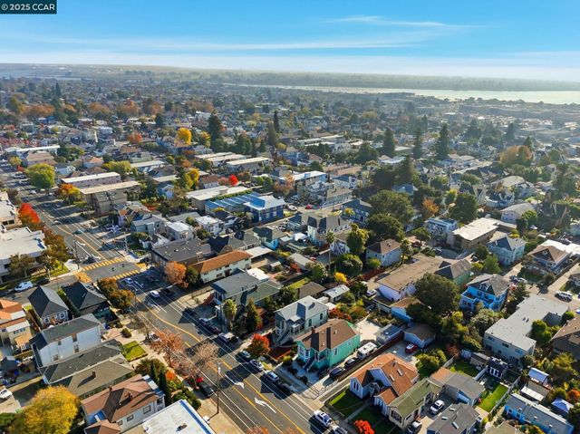 an aerial view of multiple houses with outdoor space