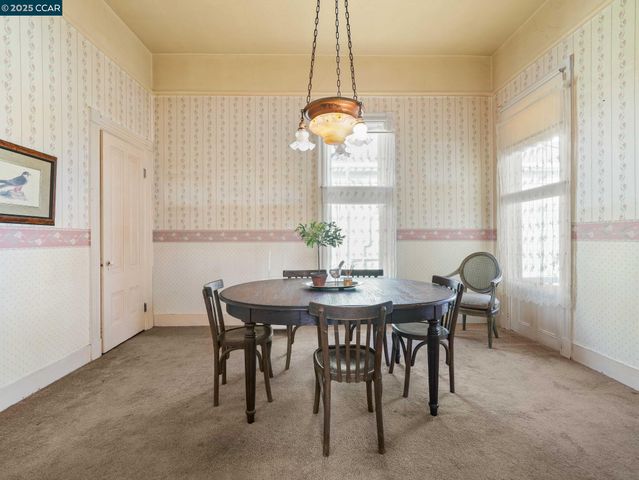 a view of a dining room with furniture window and outside view