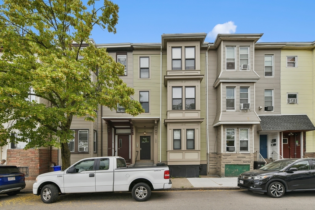 135 Havre Street, Unit 2 Boston, MA 02128 - Photo 1 of 17 a car parked in front of a building