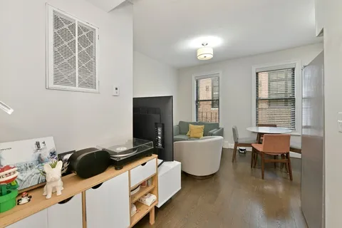 a bedroom with furniture and a window