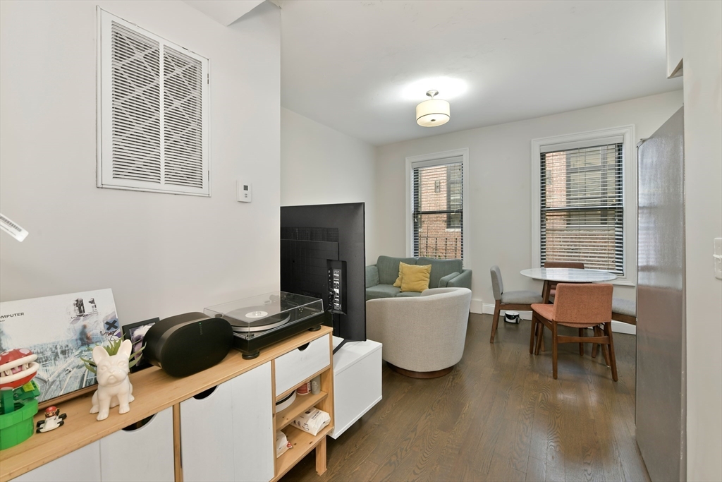 135 Havre Street, Unit 2 Boston, MA 02128 - Photo 7 of 17 a bedroom with furniture and a window
