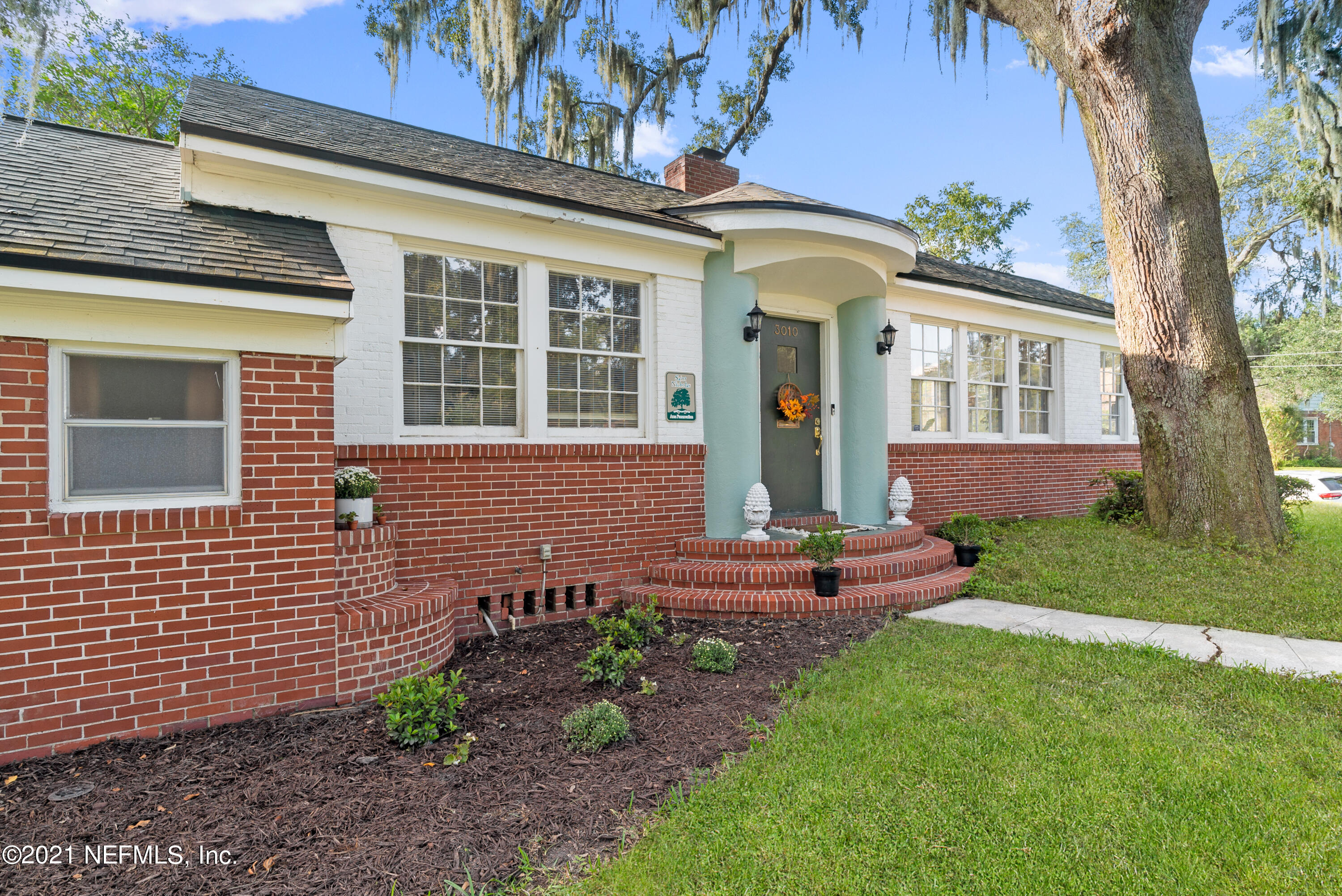 3010 Jolly Road Jacksonville, FL 32207 - Photo 2 of 41 a front view of a house with garden