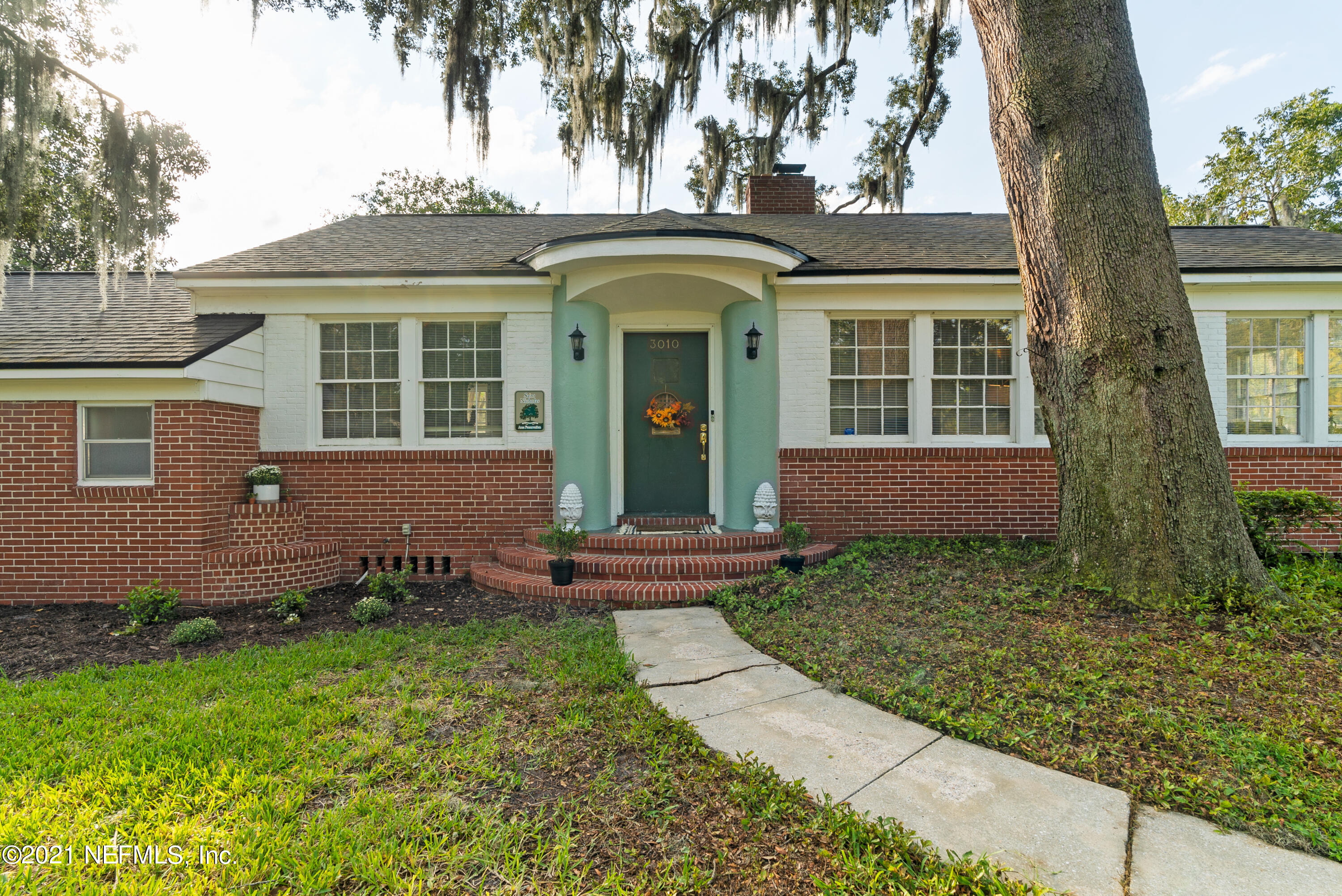 3010 Jolly Road Jacksonville, FL 32207 - Photo 3 of 41 front view of a house with a yard