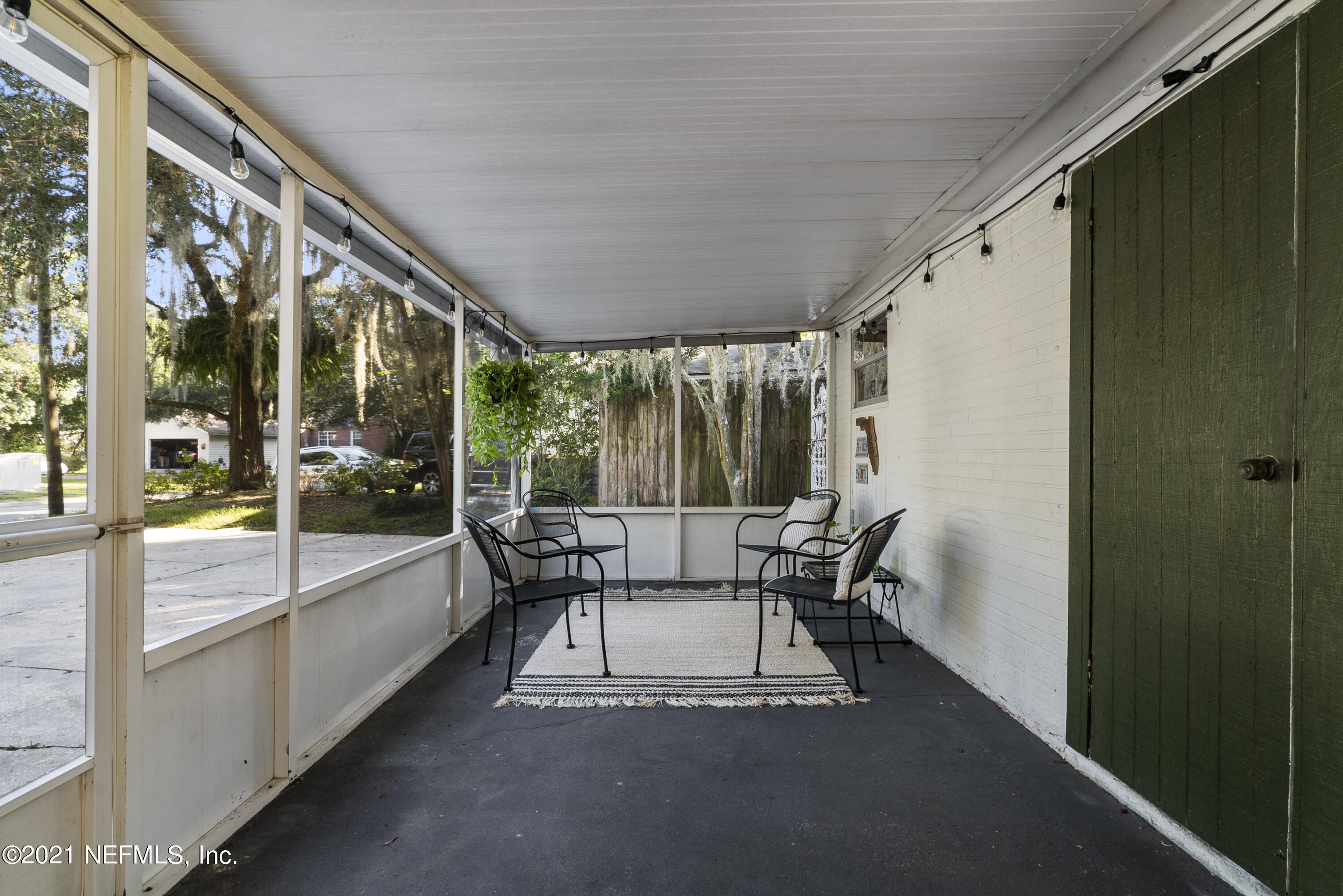3010 Jolly Road Jacksonville, FL 32207 - Photo 34 of 41 a balcony with couple of chairs and a potted plant