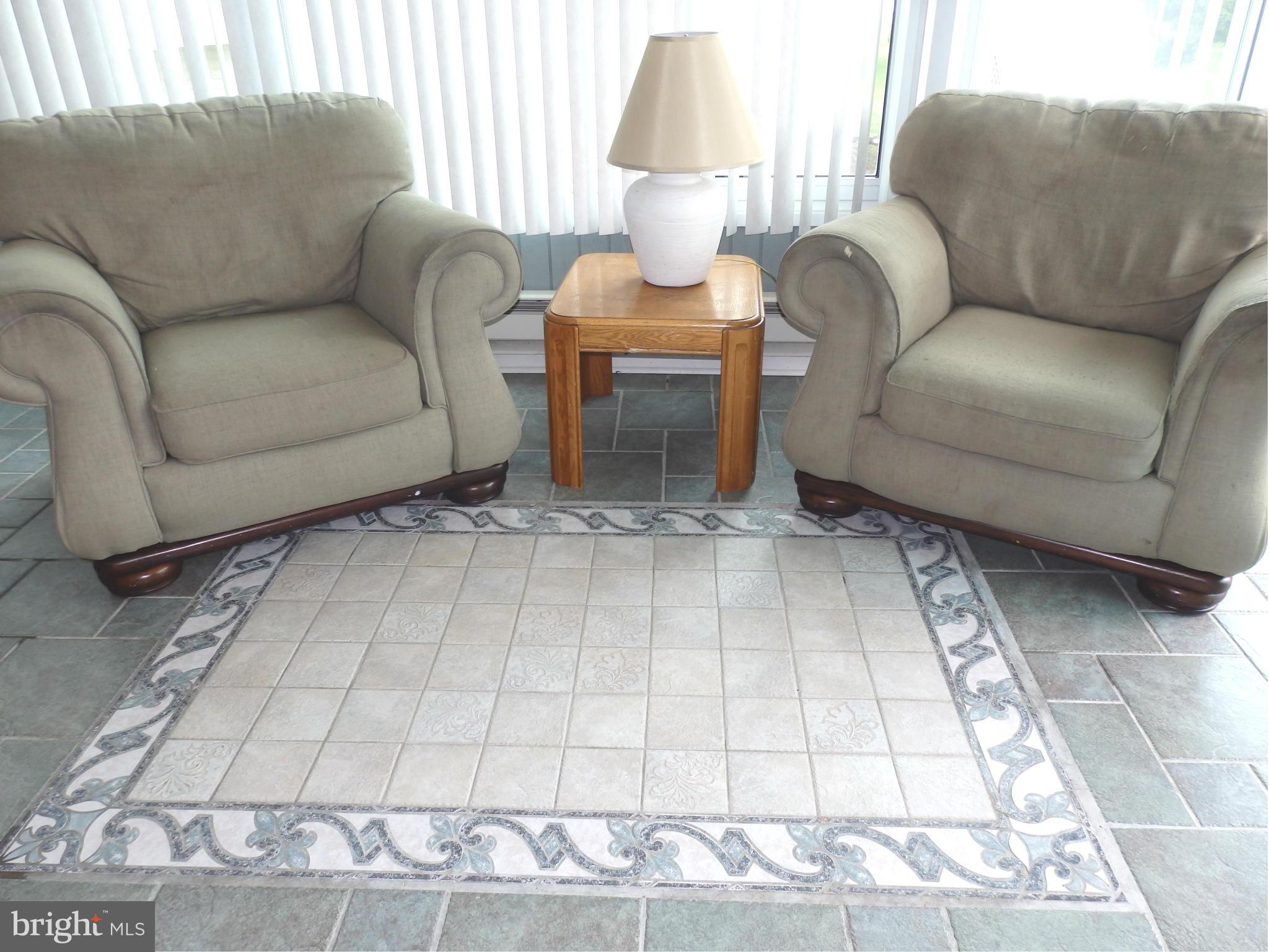 2543 Bear Den Road Frederick, MD 21701 - Photo 12 of 30 a living room with a couch and a table