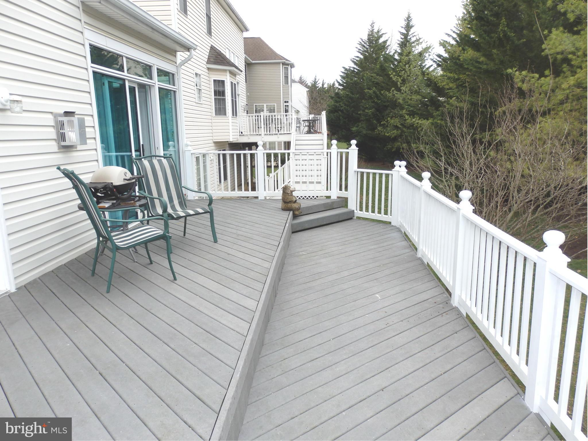 2543 Bear Den Road Frederick, MD 21701 - Photo 14 of 30 a view of a house with wooden deck and furniture