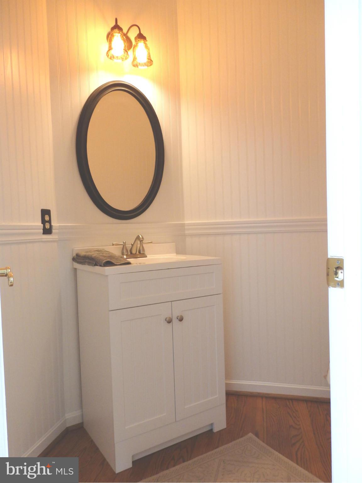 2543 Bear Den Road Frederick, MD 21701 - Photo 15 of 30 a bathroom with a sink a mirror and a toilet