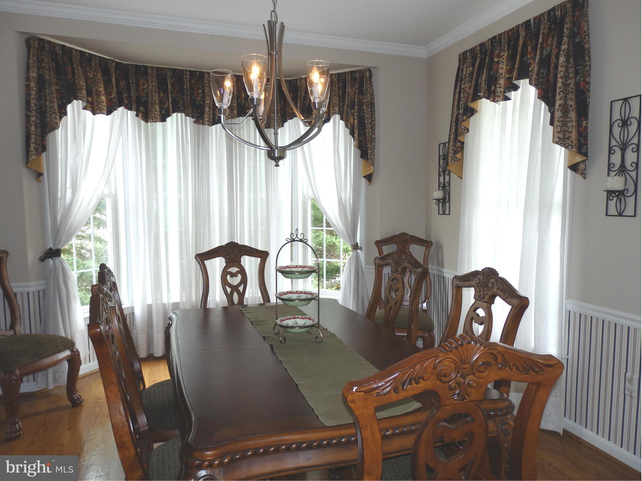 2543 Bear Den Road Frederick, MD 21701 - Photo 6 of 30 a view of a dining room with furniture window and wooden floor