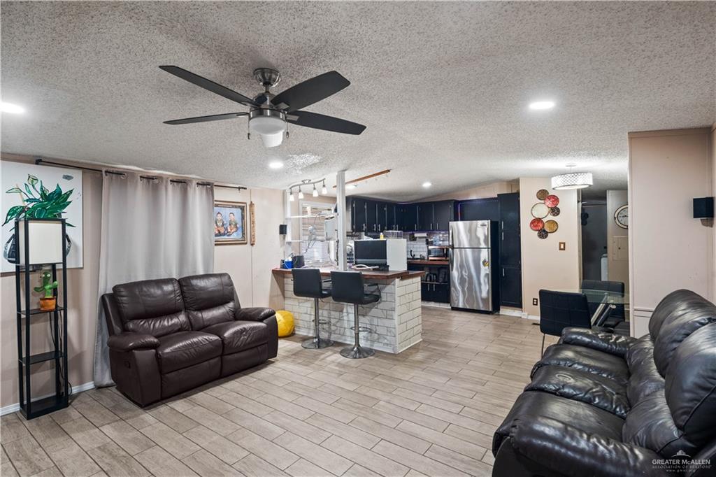 48 Gladiola Street Alamo, TX 78516 - Photo 11 of 14 a living room with furniture kitchen view and a window