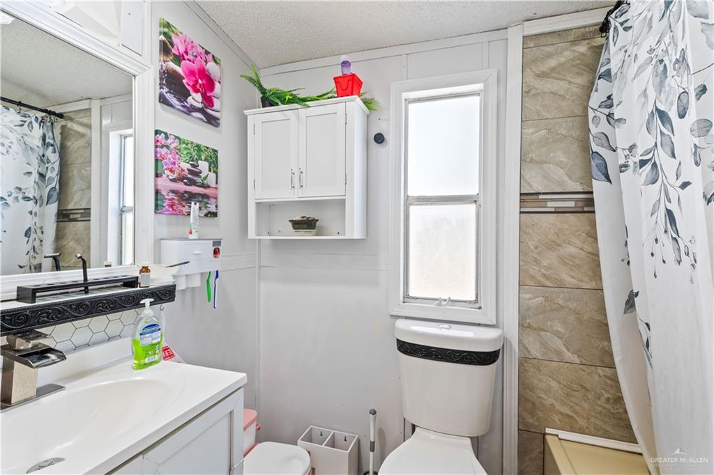 48 Gladiola Street Alamo, TX 78516 - Photo 7 of 14 a bathroom with a sink toilet and window