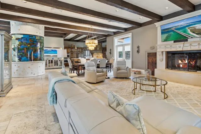 front view of a brick house with a yard table and chairs