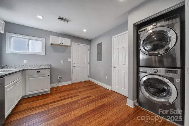 a bedroom with a bed and cabinets