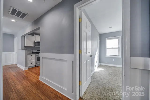 a view of a kitchen cabinets and wooden floor