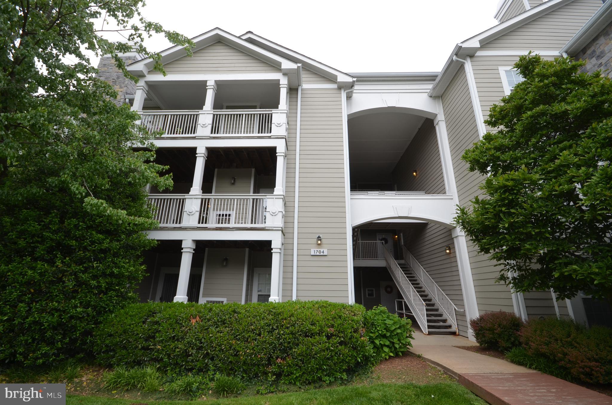 1704 Lake Shore Crest Drive, Unit 26 Reston, VA 20190 - Photo 1 of 30 Building entrance, balcony view.