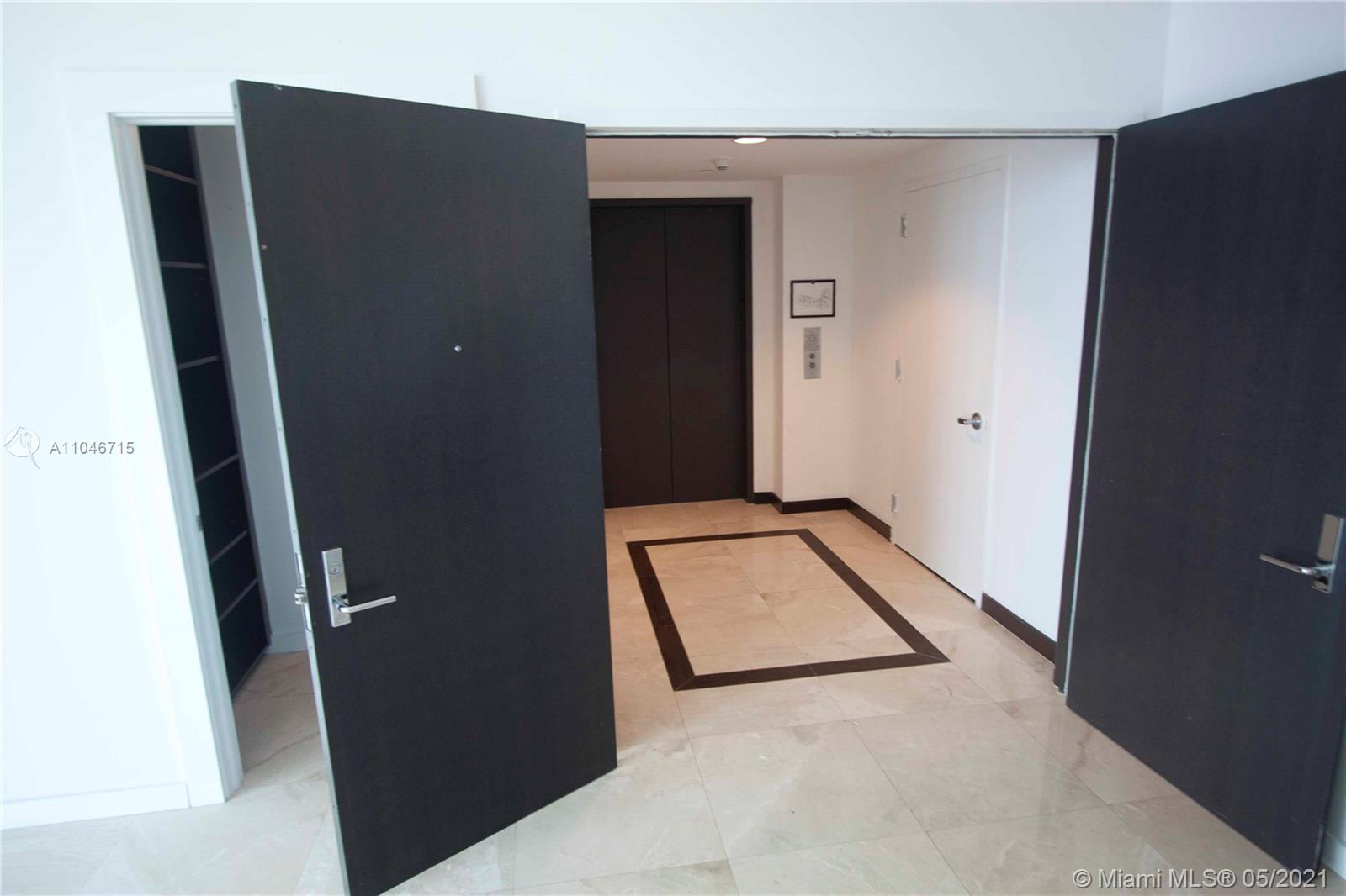 900 Biscayne Boulevard, Unit 5502 Miami, FL 33132 - Photo 2 of 19 a view of cupboard