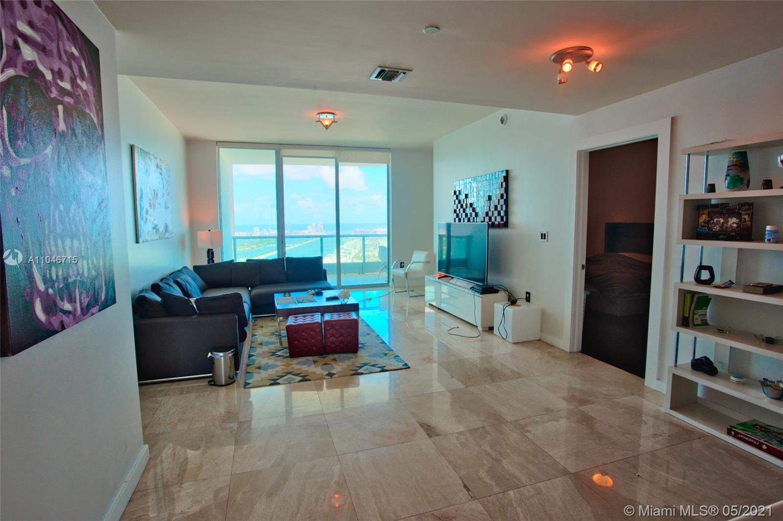 900 Biscayne Boulevard, Unit 5502 Miami, FL 33132 - Photo 3 of 19 a living room with furniture and a window