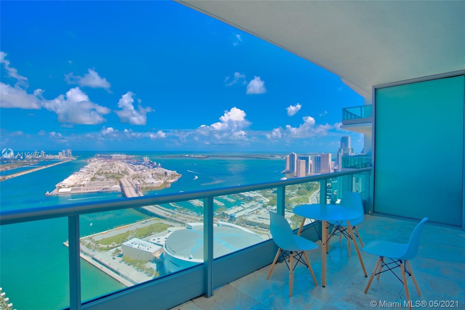 900 Biscayne Boulevard, Unit 5502 Miami, FL 33132 - Photo 7 of 19 a view of a dining room with furniture and chandelier