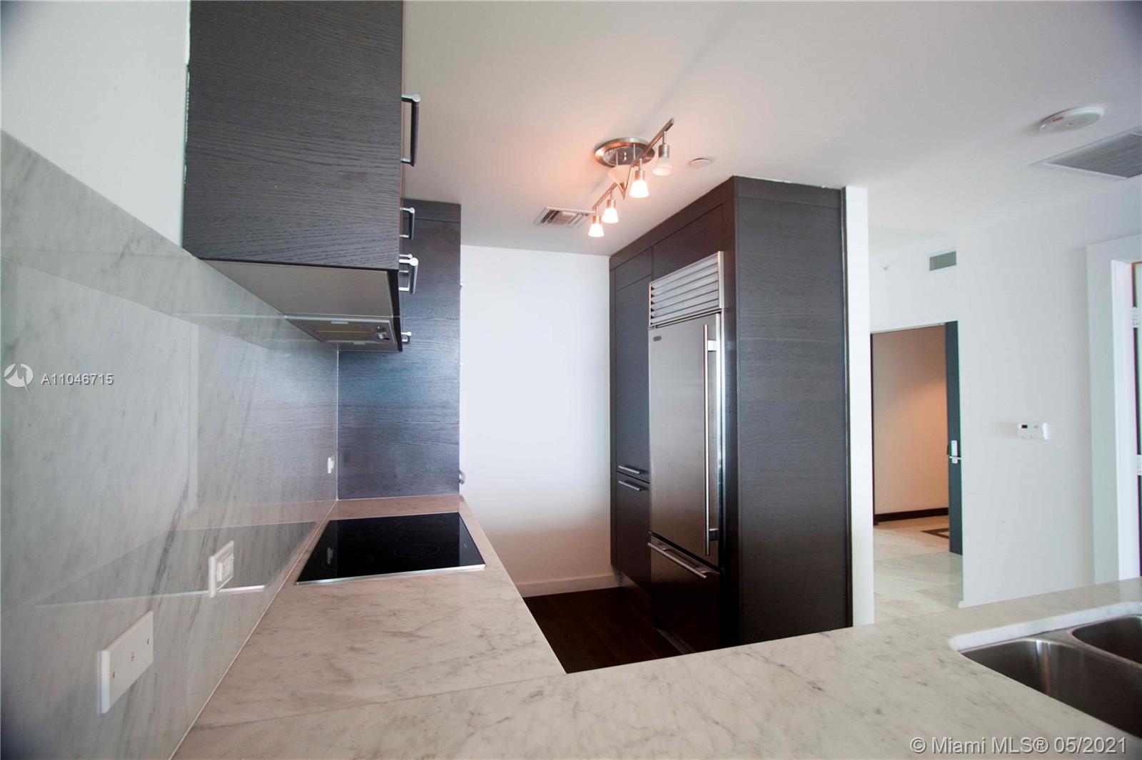 900 Biscayne Boulevard, Unit 5502 Miami, FL 33132 - Photo 9 of 19 a view of a hallway view with staircase