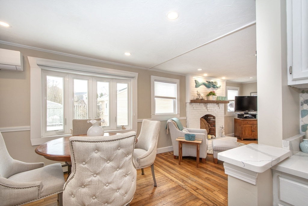 85 Constitution Road Marshfield, MA 02050 - Photo 11 of 36 a living room with furniture and a large window