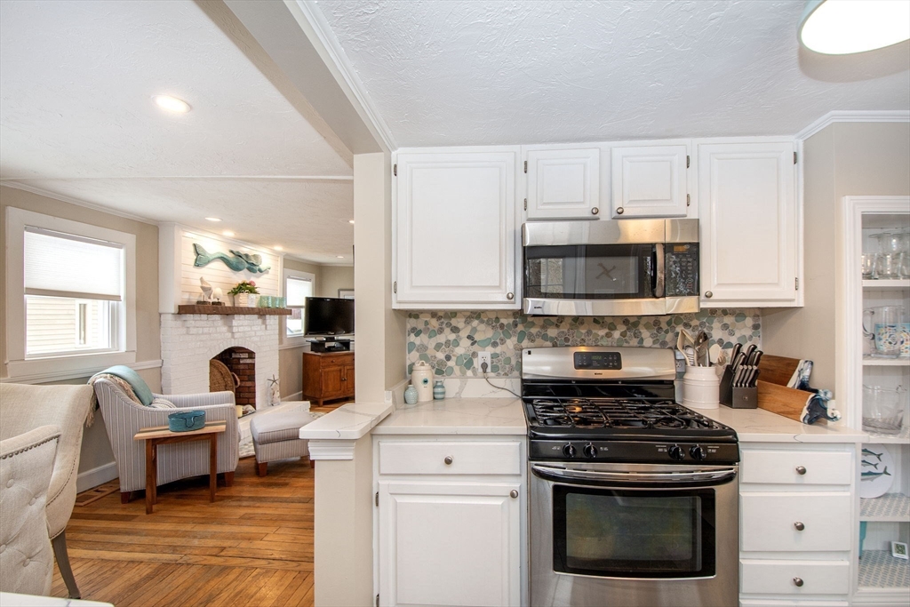 85 Constitution Road Marshfield, MA 02050 - Photo 14 of 36 a kitchen with a stove a sink and a microwave