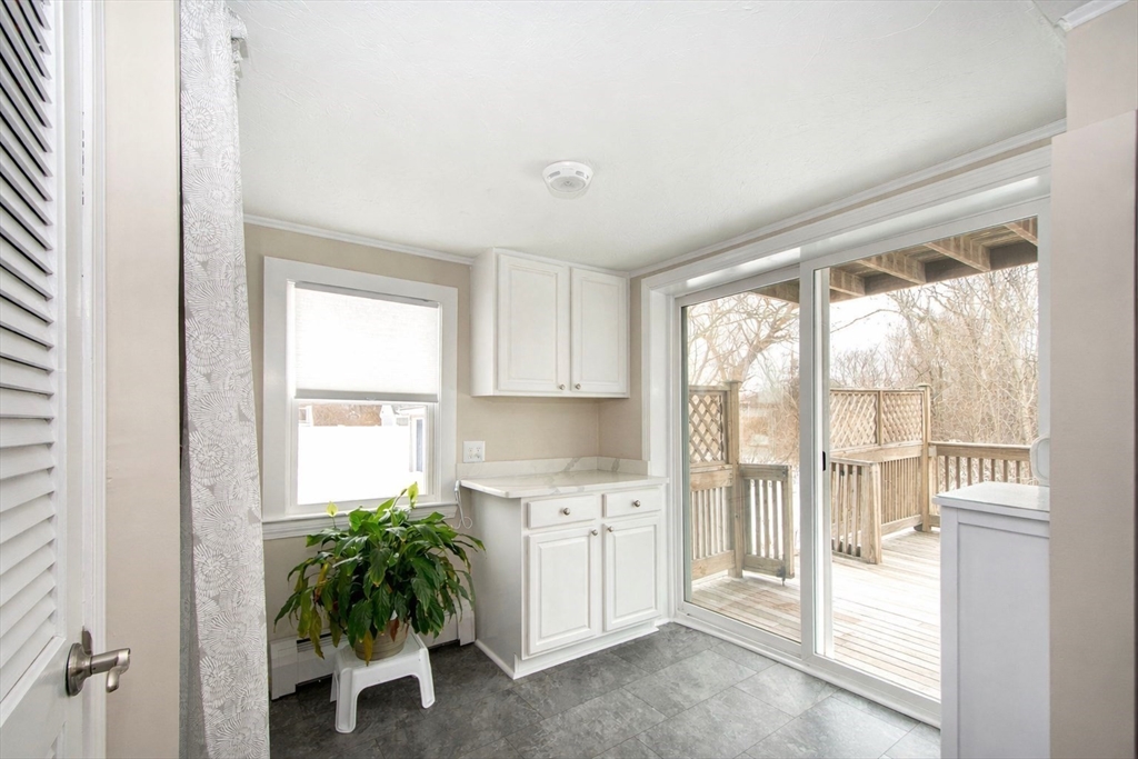 85 Constitution Road Marshfield, MA 02050 - Photo 17 of 36 a view of a kitchen with a sink and a window