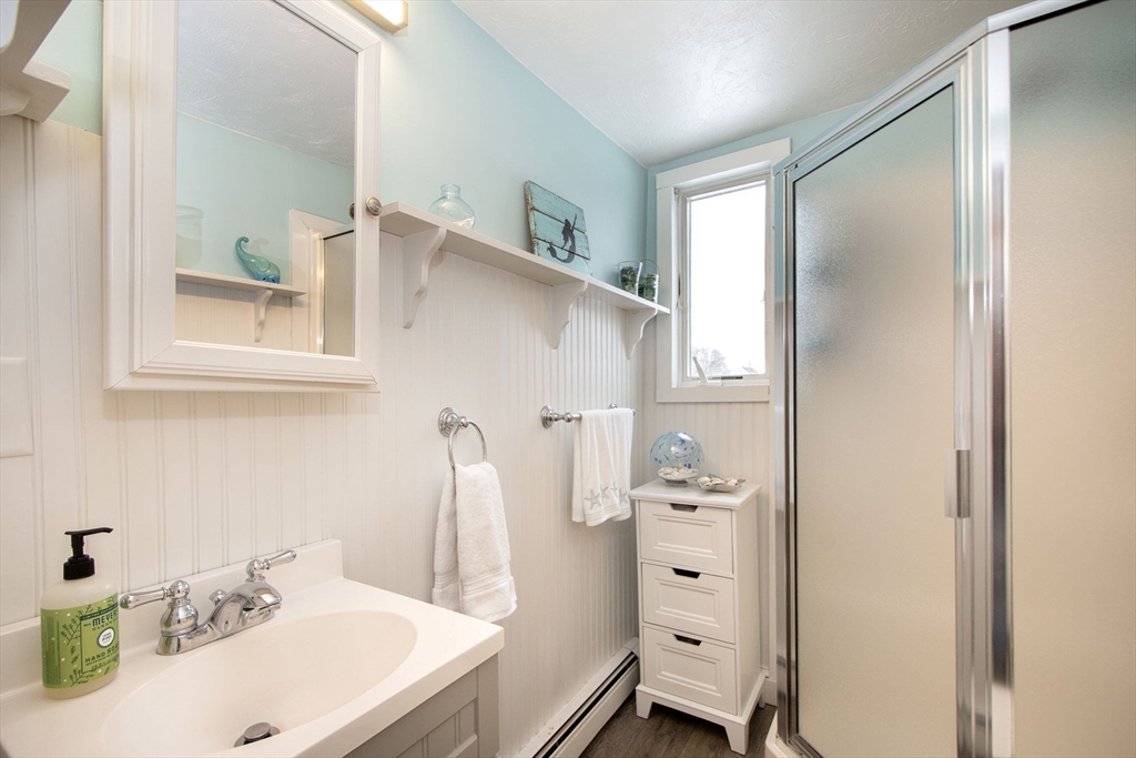 85 Constitution Road Marshfield, MA 02050 - Photo 18 of 36 a bathroom with a sink vanity and a mirror