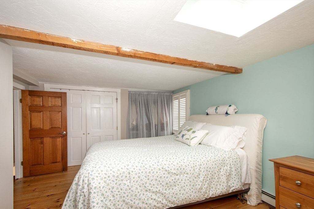 85 Constitution Road Marshfield, MA 02050 - Photo 21 of 36 a bedroom with a bed and a dresser