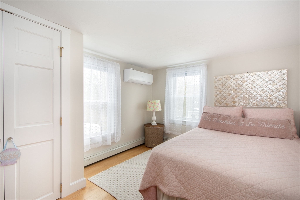 85 Constitution Road Marshfield, MA 02050 - Photo 24 of 36 a bedroom with a bed and a window