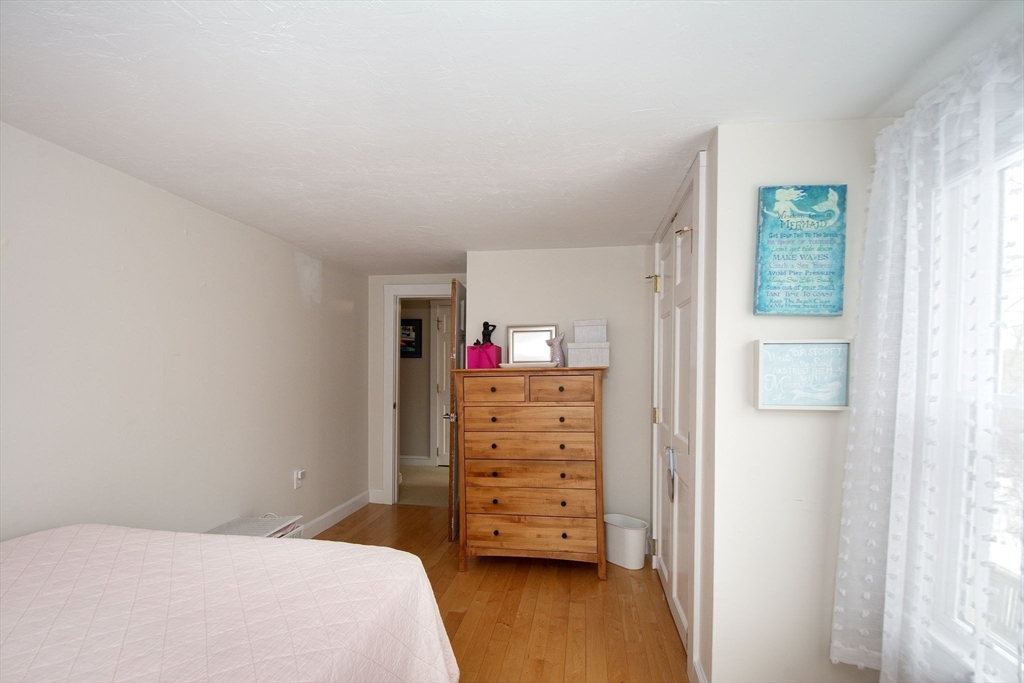 85 Constitution Road Marshfield, MA 02050 - Photo 25 of 36 a bedroom with a bed and a dresser