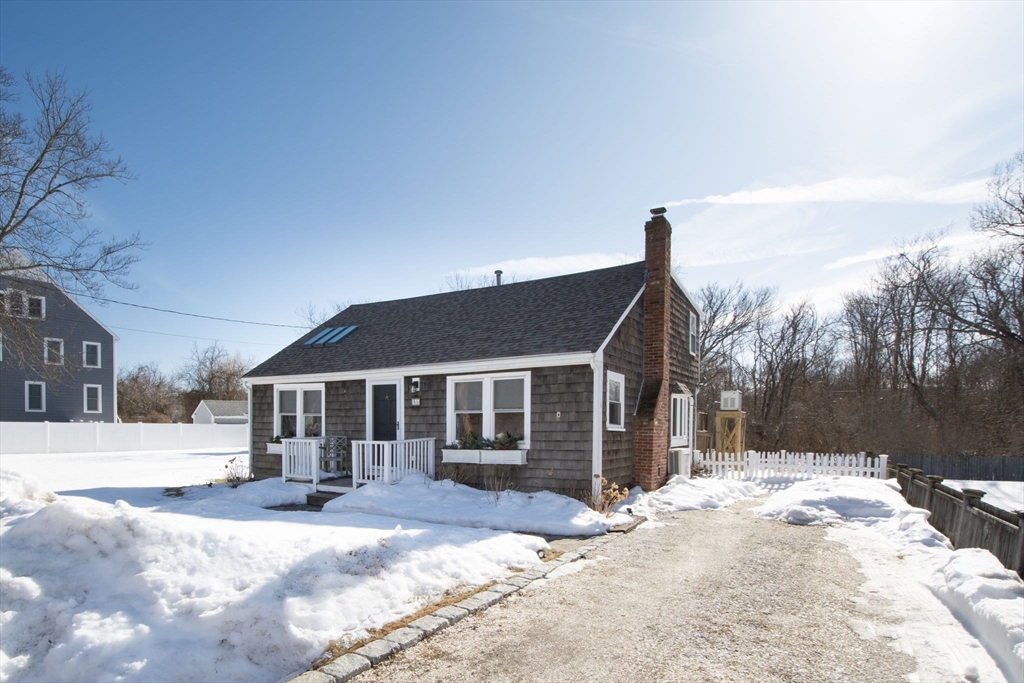 85 Constitution Road Marshfield, MA 02050 - Photo 3 of 36 a front view of a house with a yard covered in snow
