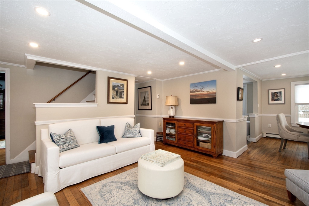 85 Constitution Road Marshfield, MA 02050 - Photo 8 of 36 a living room with furniture and a wooden floor