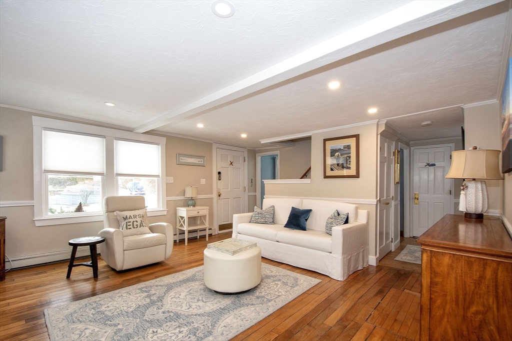 85 Constitution Road Marshfield, MA 02050 - Photo 9 of 36 a living room with furniture and a large window
