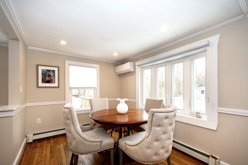 85 Constitution Road Marshfield, MA 02050 - Photo 10 of 36 a view of a dining room with furniture window and wooden floor