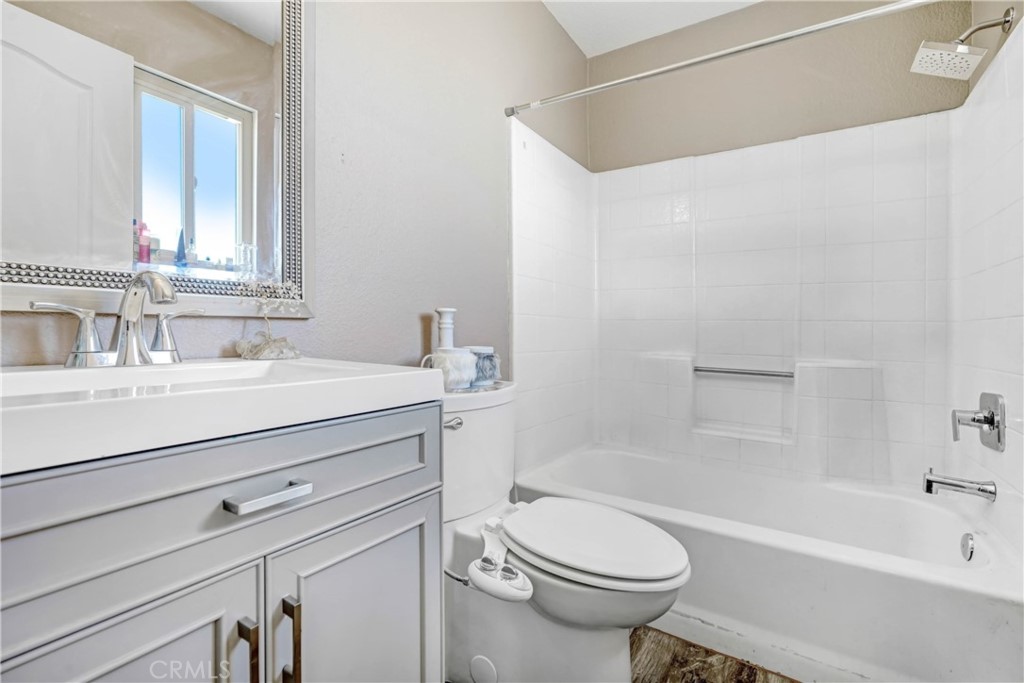 15395 Apache Road Apple Valley, CA 92307 - Photo 13 of 20 a bathroom with a sink a toilet and a bathtub